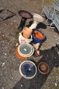 A COLLECTION OF GARDEN ORNAMENT AND PLANTERS, including a concrete and a glazed birdbath 48cm and