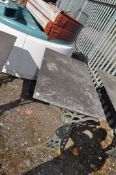 A CAST IRON TABLE BASE, with discoloured white marble top width 106cm, depth 61cm, height 71cm.