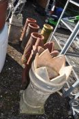 A COLLECTION OF VINTAGE CHIMNEY POTS, tallest being 88cm high. Condition report: losses to most,