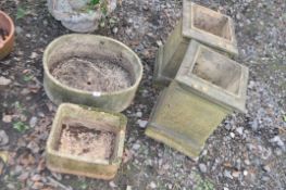 TWO PLANTERS AND TWO CHIMNEY POTS, the oval planters length 51cm. Condition Report: some weathering