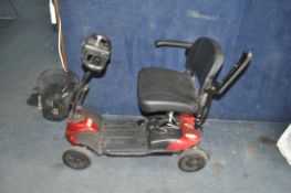 A DRIVE MOBILITY STRIDER MOBILITY SCOOTER (SPARES OR REPAIRS) with charger and one key (battery
