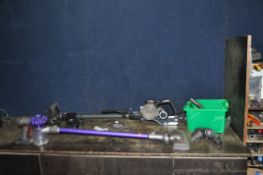 A VAX BLADE 4 CORDLESS VACUUM CLEANER with battery, charger, wall bracket and a Dyson V6 Animal