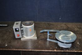 AN ALEC TIRANTI ELECTRIC CRUCIBLE KILN with a digital readout along with a pottery banding wheel (