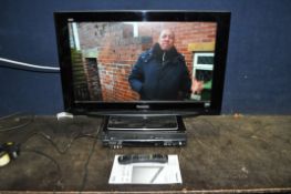 A PANASONIC TX-32LZD80 32in TV with manual and remote along with a Panasonic DVD/VHS recorder (