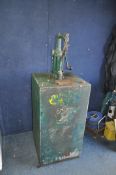 A MID 20th CENTURY OIL DISPENSER with hand cranked pump, original labelling partially worn away (see