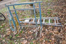 A PAIR OF BUILDERS ADJUSTABLE TRESTLE FRAMES width 97cm minimum height 107cm and a step ladder (