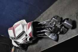 A PING GOLF BAG CONTAINING MOSTLY DUNLOP CLUBS including No Problem 5,6,7,8,9,P irons, NP2 22
