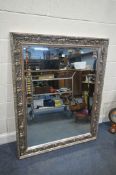 A MODERN SILVERED FOLIATE PATTERNED WALL MIRROR, with a bevelled edge plate, 111cm x 139cm,