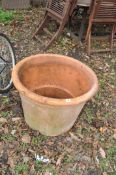 A LARGE TERRACOTTA PLANT POT, 69cm in diameter. Condition Report: minor crazing to top rim but no