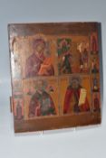 AN ORTHODOX ICON depicting four panels with holy figures to the left and right borders, the panels