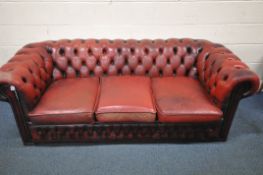 A BURGUNDY LEATHER THREE SEATER CHESTERFIELD SOFA, length 205cm x depth 90cm x height 70cm,