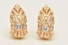 A PAIR OF 18CT GOLD DIAMOND SET CLIP ON EARRINGS, each earring set with a central round brilliant