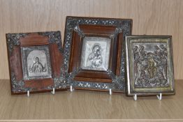 THREE METAL ORTHODOX ICONS to include Saint Luke, framed with metal corner adornments, a white metal