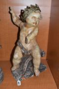 A LARGE POLYCHROME WOODEN SCULPTURE OF A CHILD sat on a carved crested wave, height 55cm x width