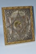 AN ORTHODOX 'MOTHER OF GOD' ICON with a fitted oklad with two overlapping 'diamond-shaped' motifs,