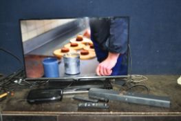 A SAMSUNG UE40H50000AK 40in TV with remote, a Humax free view box with remote, a Sony DVD player