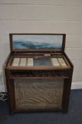 A VINTAGE ROCK-OLA PRINCESS CONSOLE MODEL 461 JUKEBOX with one 45 inside (PAT pass and working).