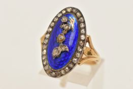 A VICTORIAN YELLOW METAL BLUE GUILLOCHE ENAMEL AND DIAMOND RING, of an oval form, the blue guilloche