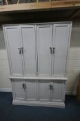 A LARGE PAINTED PINE HOUSE-KEEPERS CUPBOARD, fitted with for sets of double cupboard doors,