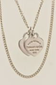 A 'PLEASE RETURN TO TIFFANY & CO NEW YORK' HEART PENDANT WITH A CHAIN, two heart pendants, one