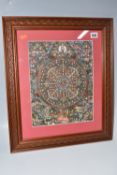 A FRAMED TIBETAN THANGKA painted on cotton or silk (sealed within frame so unchecked) depicting
