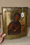 AN ORTHODOX 'VIRGIN MARY' ICON, nineteenth century of the Russian School with a partial brass