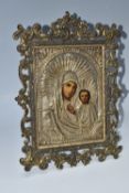 AN ORTHODOX 'MOTHER OF GOD' ICON with fitted oklad mounted in a modern brass frame, height 33cm x