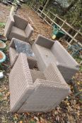A WOVEN RATTAN GARDEN SET comprising of a two seat sofa (150cm wide), two chairs and coffee table