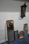 A WALNUT VIENNA WALL CLOCK, height 89cm, along with three various wall mirrors, swing mirror, a