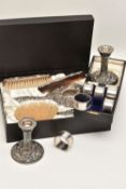 AN ASSORTMENT OF SILVER ITEMS, to include a pair of embossed foliate pattern candlesticks, on