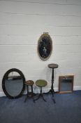 AN OAK OVAL BEVELLED EDGE WALL MIRROR, a gilt frame wall mirror, two other mirrors, a plant stand, a