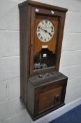 AN EARLY TO MID 20TH CENTURY OAK CLOCKING IN MACHINE, the enamel dial reads a label 'AutoK Time
