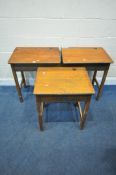 A PAIR OF OAK SCHOOL DESKS, with a hinged storage compartment, width 62cm x depth 46cm x height