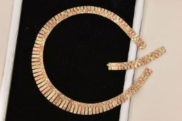 A BOXED 9CT GOLD TRI-COLOUR CLEOPATRA NECKLACE, AF will require attention broken link, fitted with a
