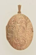 A 9CT GOLD OVAL LOCKET, scrolling foliate pattern, fitted with a tapered bail, hallmarked 9ct