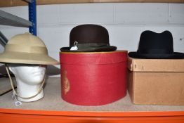 THREE HATS, comprising a khaki pith helmet with green lining and khaki chin strap (strap has been