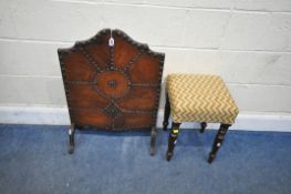 AN EARLY 20TH CENTURY FIRE SCREEN, with studded leather front, raised on shaped legs, width 54cm x