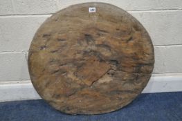 AN ANTIQUE WOODEN WHEEL, with a central rectangular block and slot, diameter 74cm, condition report: