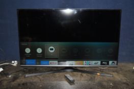 A SAMSUNG UE49KU6470U SMART TV with remote (spares or repair, doesn't appear to tune to