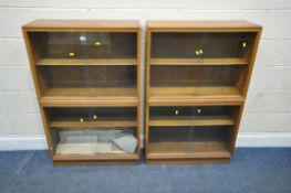 A PAIR OF EARLY 20TH CENTURY OAK BOOKCASES, each with four glass sliding doors, width 77cm x depth