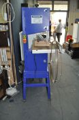 A CHARNWOOD W720 BANDSAW ON STAND with parallel and mitre guides and spare blades total height 171cm