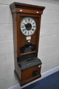 AN EARLY TO MID 20TH CENTURY OAK CLOCKING IN MACHINE, by Time Recorders Leeds Ltd, the enamel dial