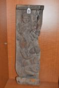 A CARVED WOODEN HINDU DEITY PLAQUE depicting a multi-armed deity carrying a trident/trishul, a