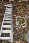 AN ALUMINIUM TRIPLE EXTENSION LADDER with 12 rungs to each 320cm section, detachable wide foot, roof