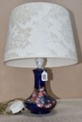 A MOORCROFT POTTERY TABLE LAMP, featuring the Anemone tube lined pattern on a deep blue ground,