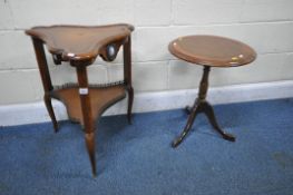 A REPRODUCTION REGENCY STYLE CHERRYWOOD WAVY TRIANGULAR TWO TIER TABLE, with a brown leather top