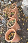 A SET OF FOUR TERRACOTTA PLANTERS, inscribed to the side Yorkshire flowerpots (4)