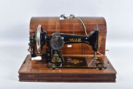 A WOODEN CASED W.J.H. 'DEFIANCE N3' HAND OPERATED SEWING MACHINE, black painted cast iron body