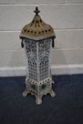 VERITAS STOVE, A 19TH CENTURY WHITE PAINTED CAST IRON HEXAGONAL STOVE, with foliate and