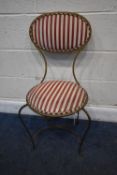 A GILT WROUGHT IRON CHAIR, with an oval backrest and circular seat, with stripped upholstery,